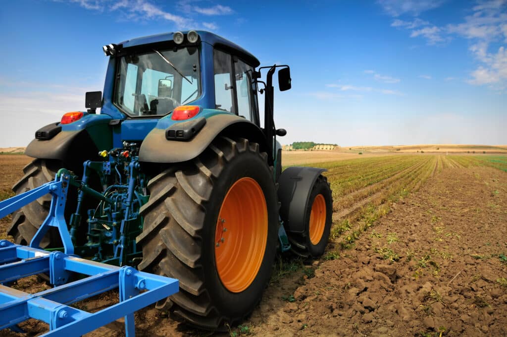 The Tractor - modern farm equipment in field